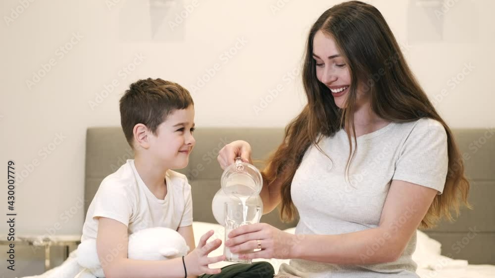 Mother and son drinking water in the morning Mother and son drinking water in the morning