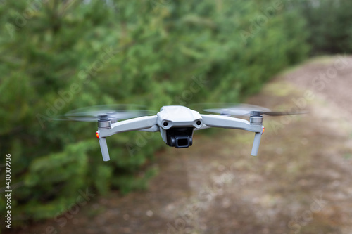 Flying drone in the forest. Flying for video and photo productions.