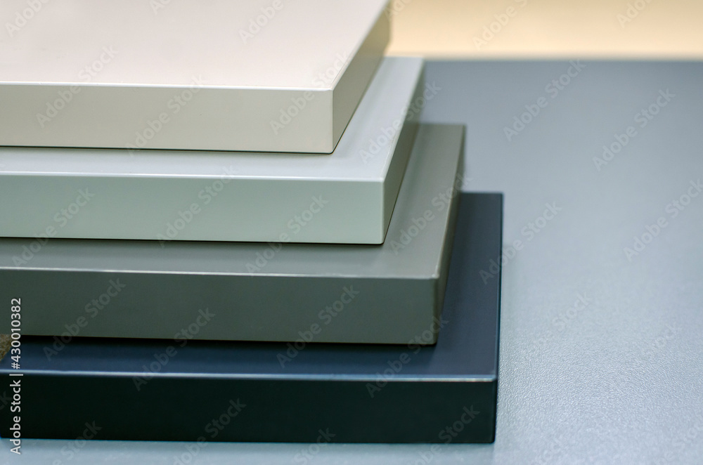 A stack of samples of furniture facades. A stack of samples of furniture facades.