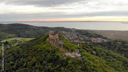 Aerial 4k drone view of the castle of Szigliget at sunset, a medieval fortress on a hill in Balaton Uplands, Hungary