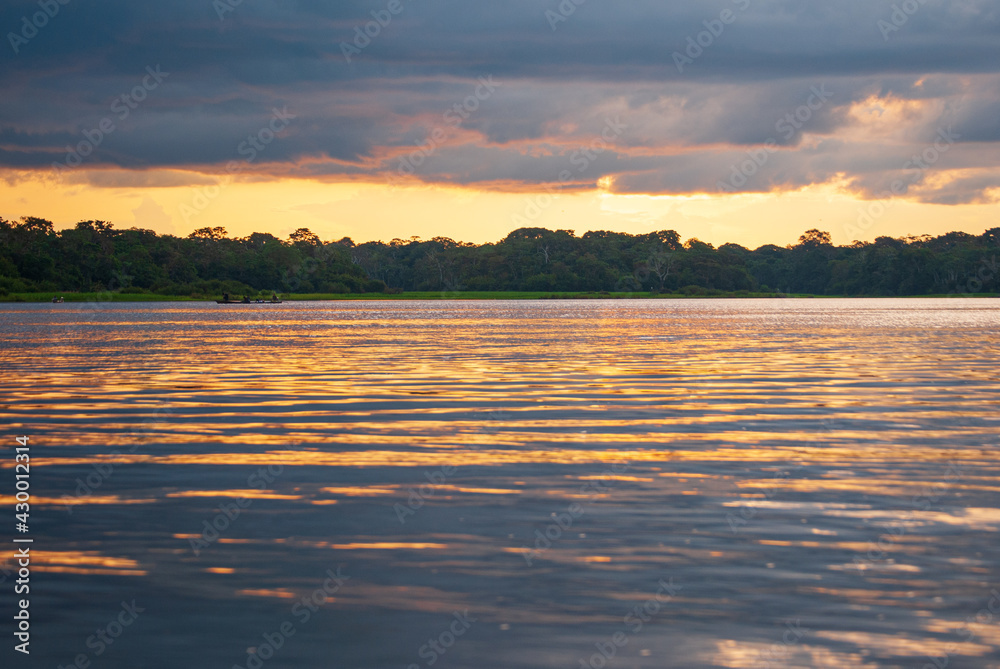 Nice sunset on the Amazon River watching indigenous boats. Nice sunset on the Amazon River watching indigenous boats.