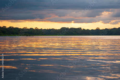 Nice sunset on the Amazon River watching indigenous boats.