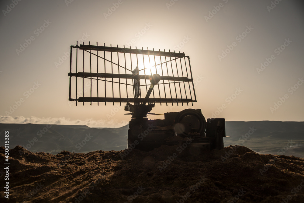 Space radar antenna on sunset. Silhouettes of satellite dishes or radio antennas against night sky. Space observatory or Air defence radar over dramatic sunset sky. Space radar antenna on sunset. Silhouettes of satellite dishes or radio antennas against night sky. Space observatory or Air defence radar over dramatic sunset sky.