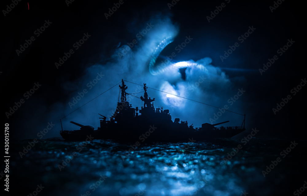 Fototapeta premium Silhouettes of a crowd standing at blurred military war ship on foggy background. Selective focus.