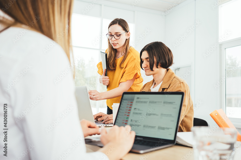Office team having meeting and discussing at coworking space. Group of business people working new strategy of company Office team having meeting and discussing at coworking space. Group of business people working new strategy of company