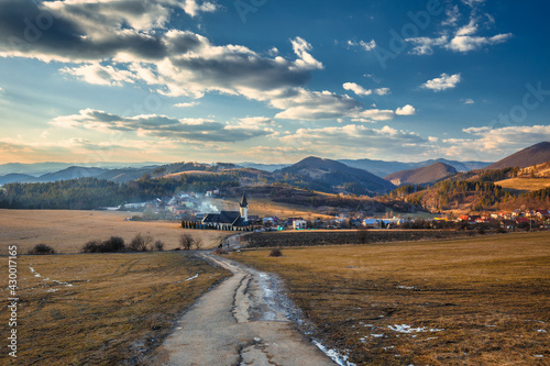 A village in the middle of a rural hilly landscape. The village of Zastranie in the north of Slovakia, Europe.