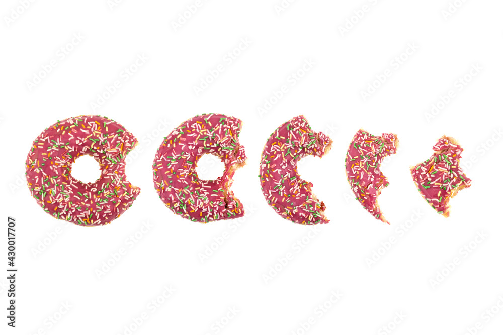 Donut close-up on a white background. Bitten donut isolated on white background.