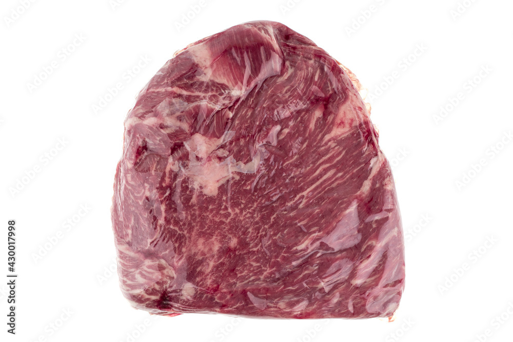 Obraz premium Vacuum packed meat on a white background. Close-up of beef in a vacuum bag.