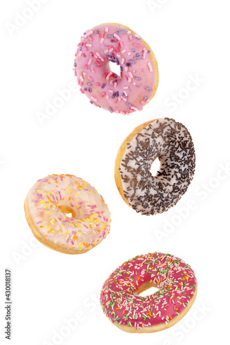 Donuts close-up on a white background. Flying round donuts isolated on white background.