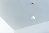 White ceiling lamp It is installed in a beautifully designed position.