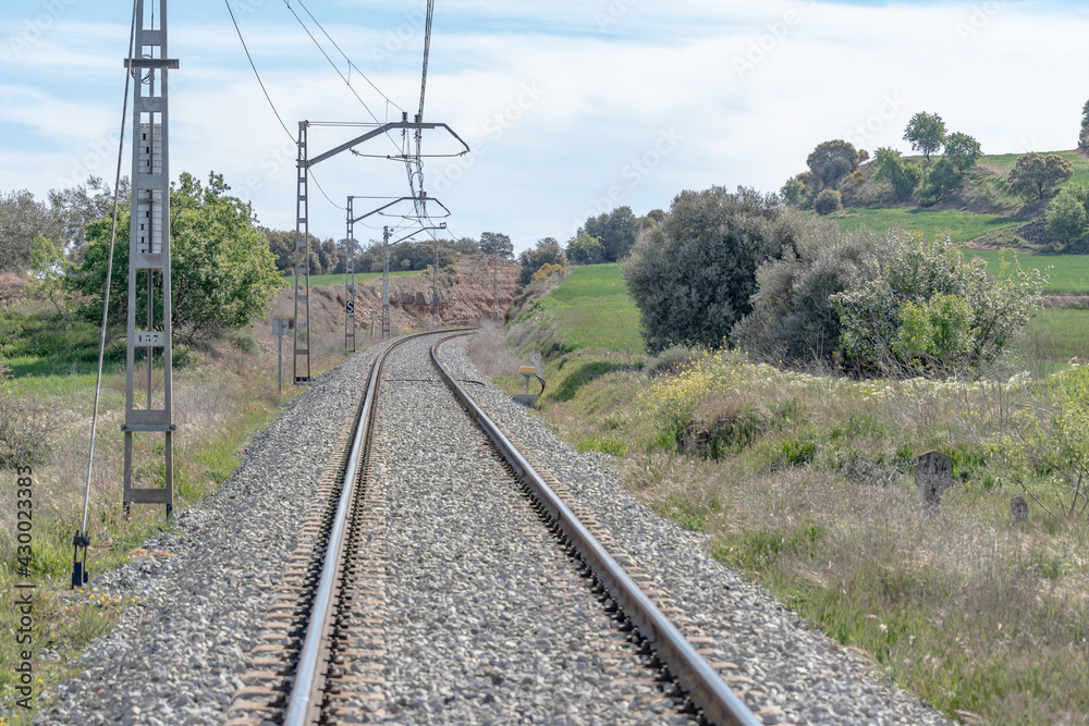 View of railroad rails with rails and catenary