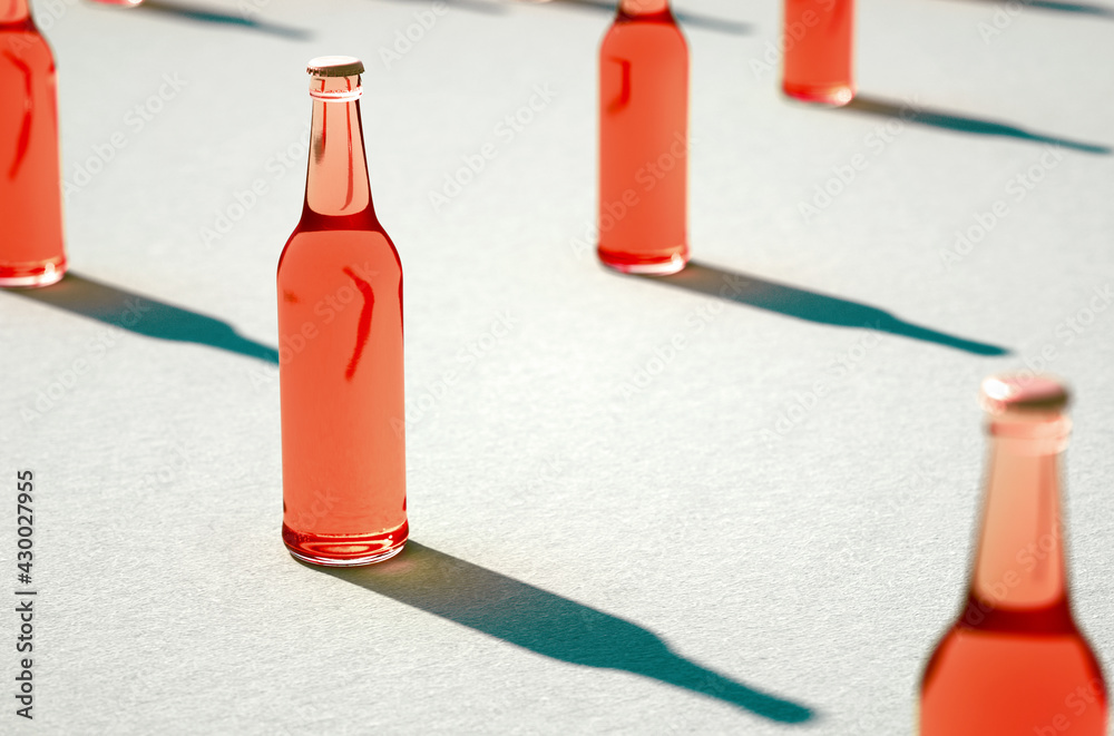 Various red glass bottles with shadows on blue background.