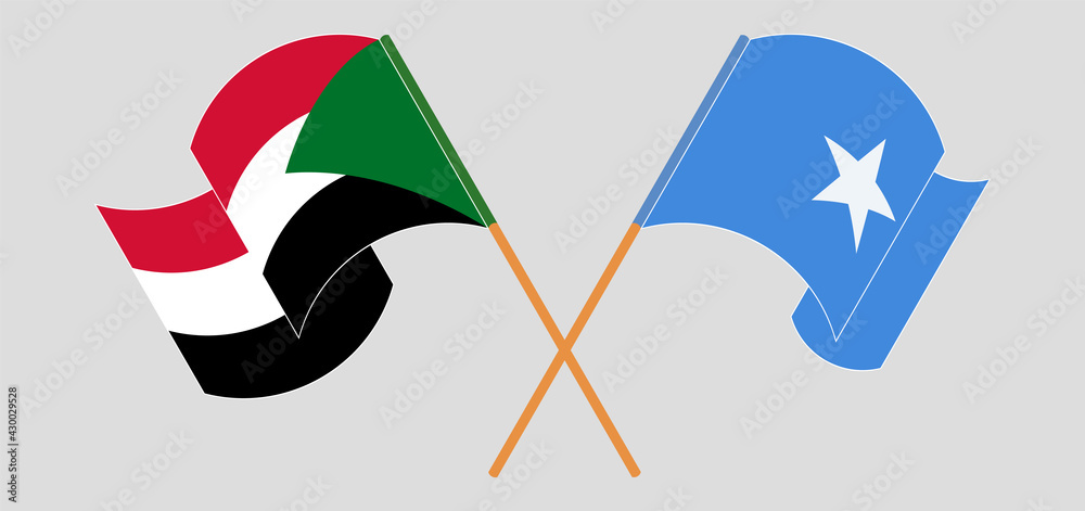 Crossed and waving flags of the Sudan and Somalia Crossed and waving flags of the Sudan and Somalia