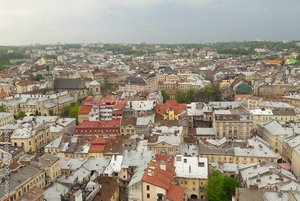 A bird's eye view of the medieval city, with brown tiled roofs.