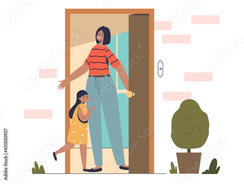 Mom welcome little daughter at home at front door after school. Mother meeting kid