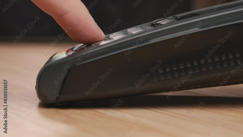Close up man hand swiping credit card and enters a pin code using POS terminal for payment. Close up man hand swiping credit card and enters a pin code using POS terminal for payment.