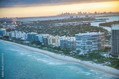 Amazing helicopter aerial view of Miami Beach coastline at winter sunset, Florida