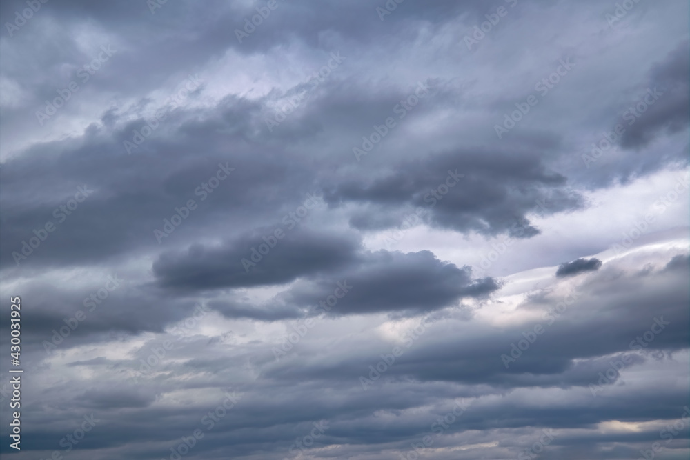 Sky with rain clouds before the storm. Background of dark clouds before a thunder-storm.