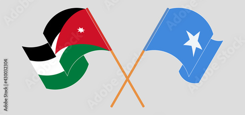 Crossed and waving flags of Jordan and Somalia