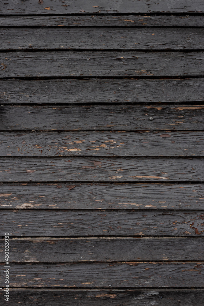 The black wood texture with natural patterns background The black wood texture with natural patterns background