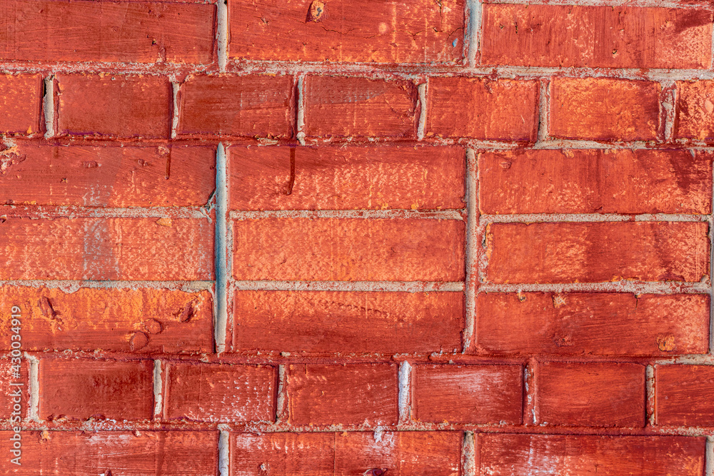 Obraz premium Bright red brick wall background. Red brick texture. Modern brickwork.