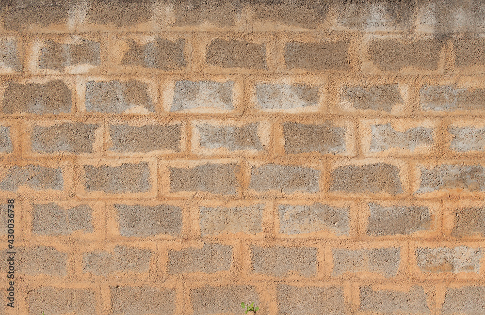 Texture of a rough wall made of cement stones with fresh mortar Texture of a rough wall made of cement stones with fresh mortar