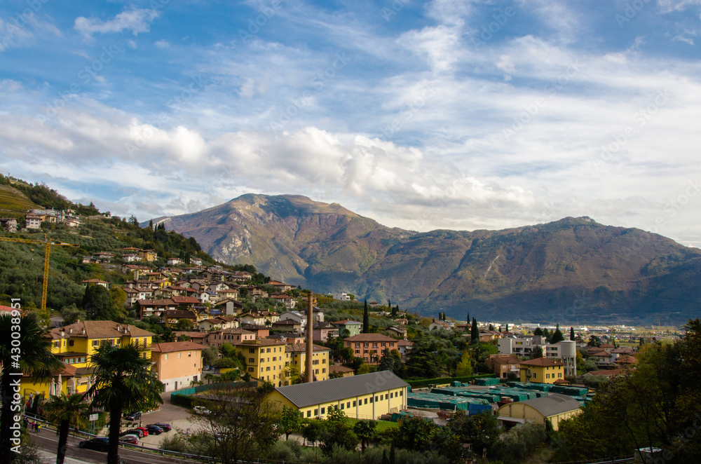 Mountain view over small industrial Italian village called Gavazzo near Lake Garda