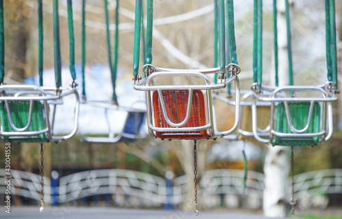 Empty chain swing in amuzement park photo