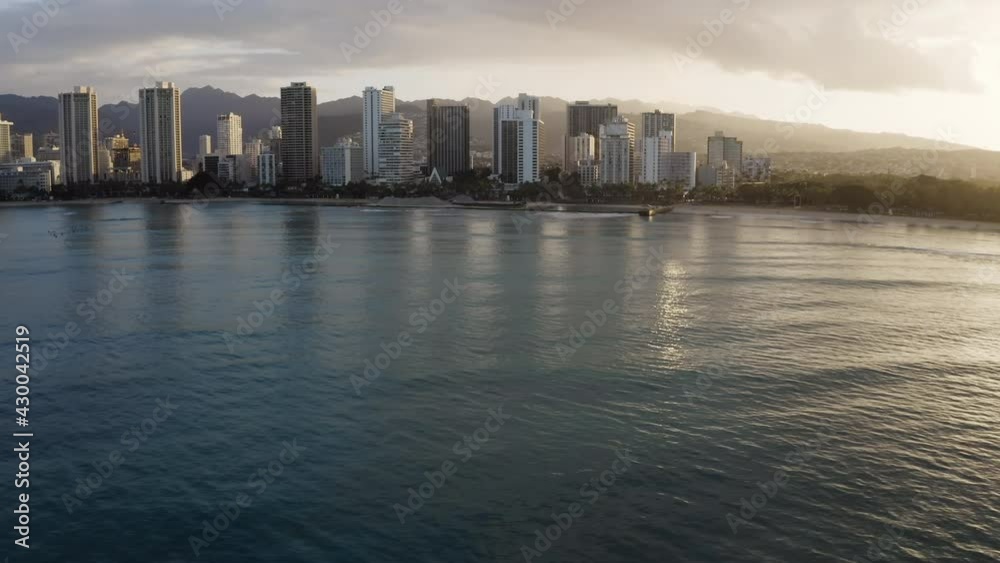 Aerial view of Waikiki Beach coastline and tall buildings by the ocean, Hawaii Aerial view of Waikiki Beach coastline and tall buildings by the ocean, Hawaii