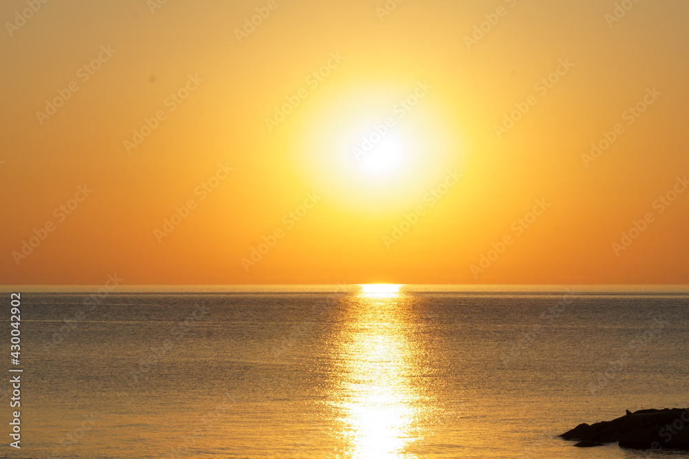 Sunrise over the calm sea
