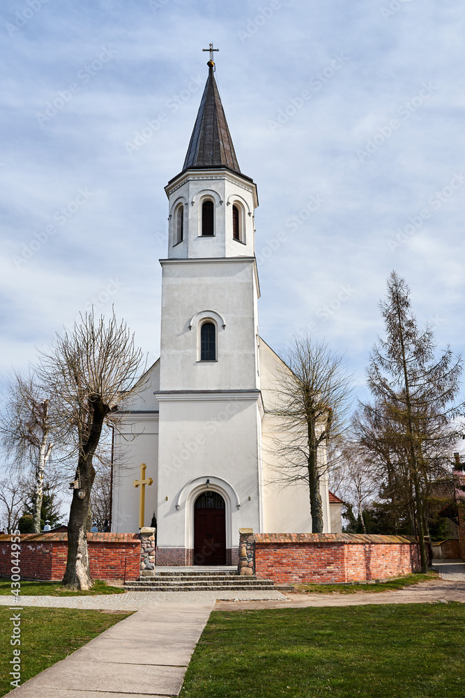 A rural Catholic church with a bell tower