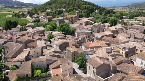 Scenic aerial view of French township of Fontcouverte at foot of Alaric mountain on sunny summer day, Aude, Occitanie photo