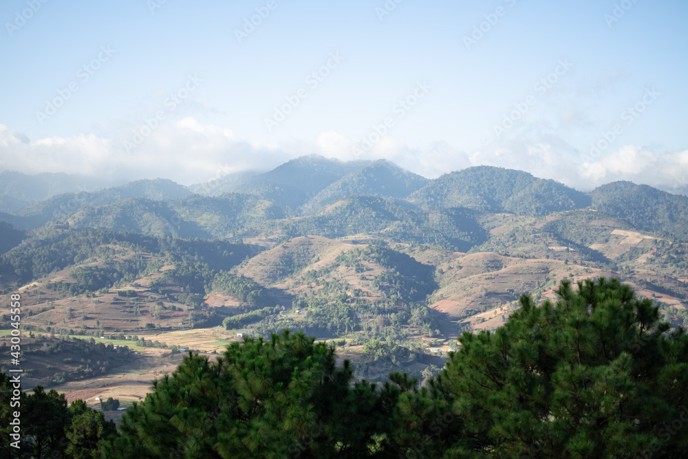 Rolling hills and farm lands with rice fields in Shan state, Myanmar