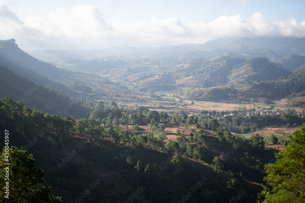Rolling hills and farm lands with rice fields in Shan state, Myanmar Rolling hills and farm lands with rice fields in Shan state, Myanmar