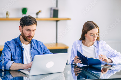 A freelance married couple working from home. A guy and a girl i