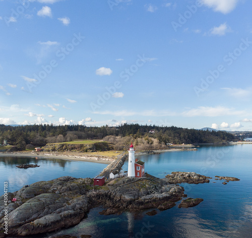 Fisgard Lighthouse on rocks near the Pacific Ocean