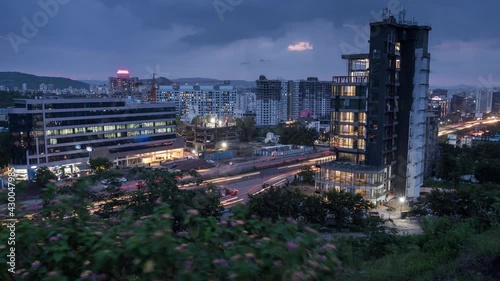 View of Busy Traffic on National Highway and Day to Night Time Lapse of City, Maharashtra, India photo