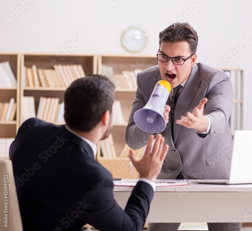 Fotografie Angry boss shouting at his employee