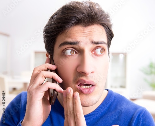 Man panicking because of pimples on the skin