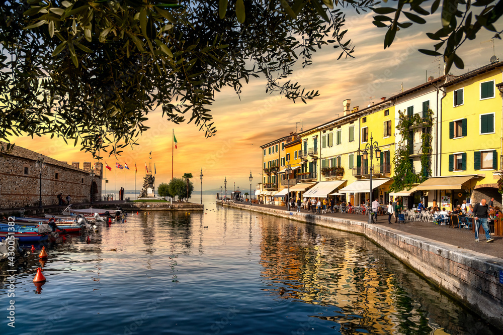 View of Lazise at the lakeside of Lake Garda in summer in the northern Italy. Lazise is a popular holiday location in Italy.