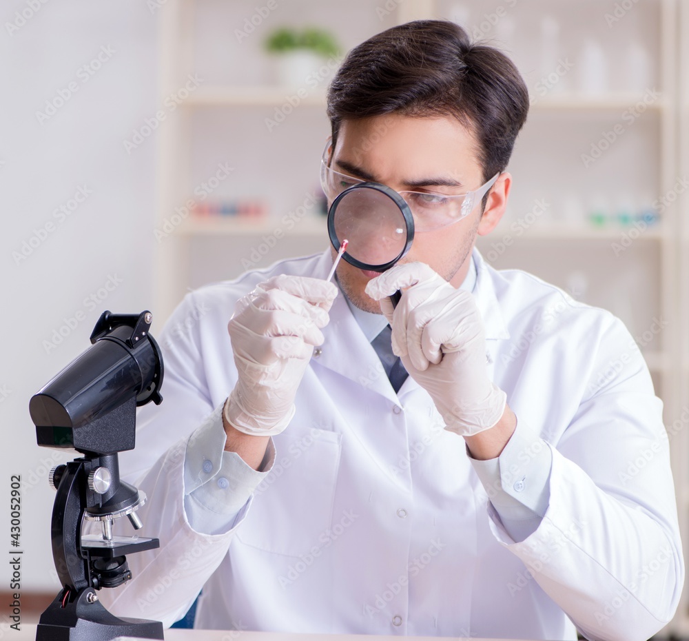 Expert criminologist working in the lab for evidence Expert criminologist working in the lab for evidence