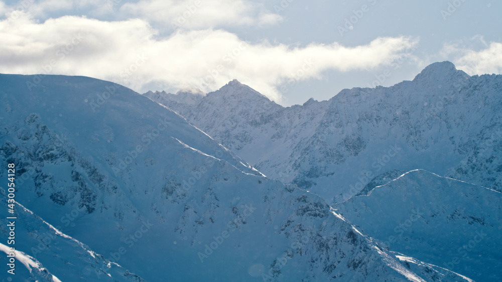 Beautiful View Of Snow-Capped Mountains Against Cloudy Sky - Foggy Weather. High quality photo
