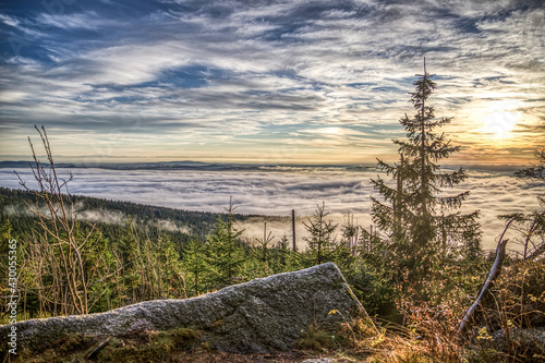 foggy view at sundown on mount Dreisessel  a mountain in the bavarian forest