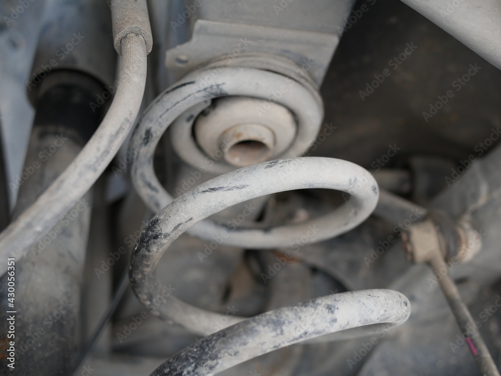 maintaining a car shock absorbers at repair service station. maintaining a car shock absorbers at repair service station.