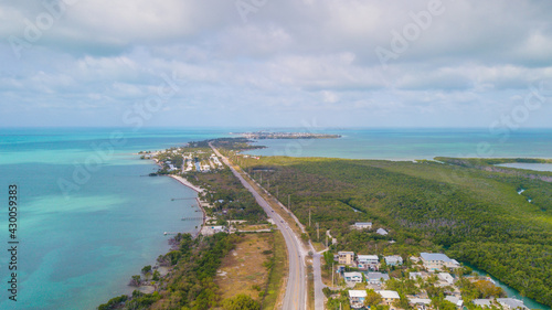 Florida Keys. Bridge or road on Key West FL. Atlantic ocean and Gulf of Mexico. Spring break or Summer vacations in Florida. Tropical nature. Aerial view.