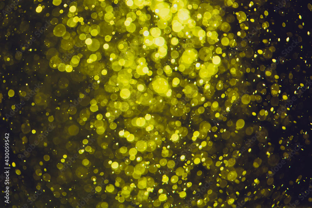 Gold bokeh of lights from water