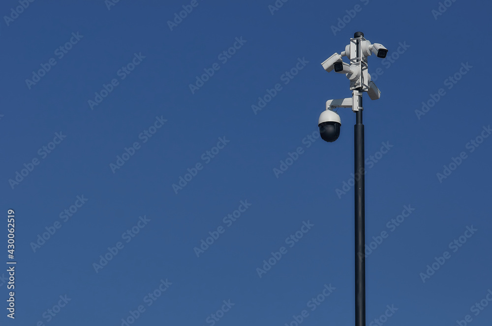 Video surveillance system against the blue sky.