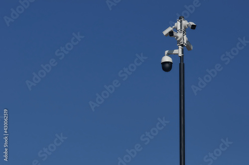 Video surveillance system against the blue sky.