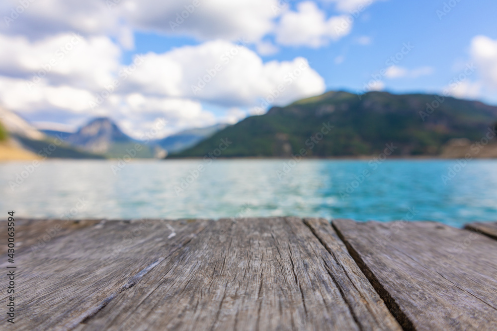 Panoramic view from wooden pier to mountains and azure lake. Beautiful summer landscape with selective focus. Taurus Canyon, Turkey