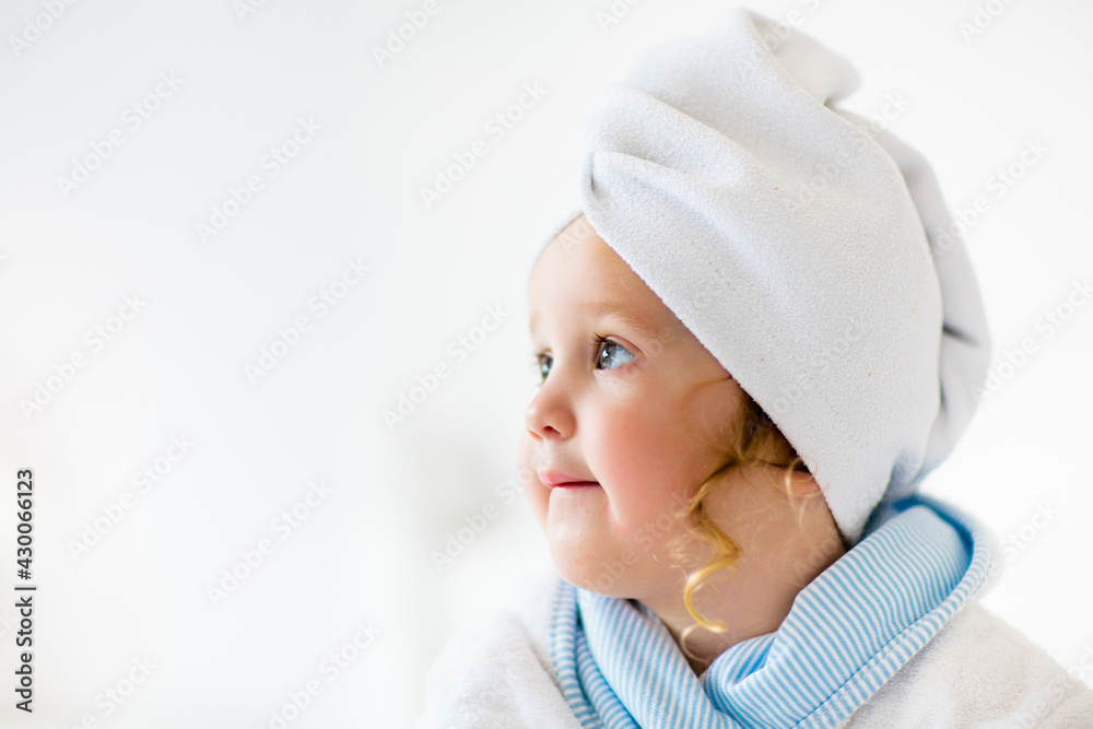 Baby girl in towel after bath. Infant care. Baby girl in towel after bath. Infant care.